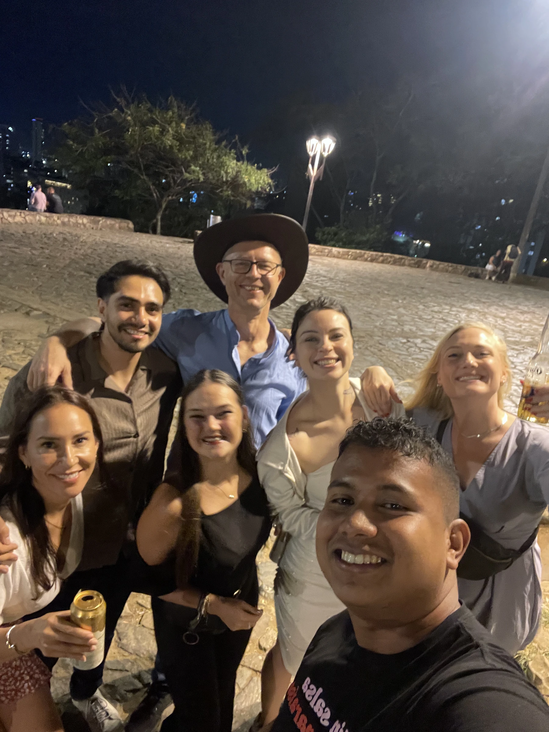 Group selfie outside during Feria de Cali 2025.